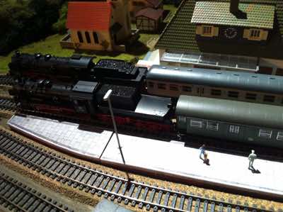 Passengers at Poggendorf station waiting to board a train on track 2.