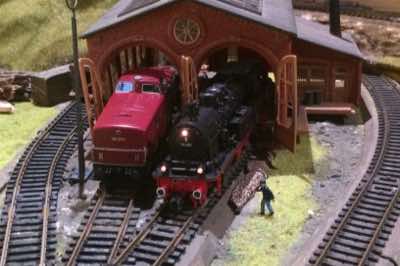 BR 280 diesel and BR 78 steam locomotive in for repair work at the locomotive depot.